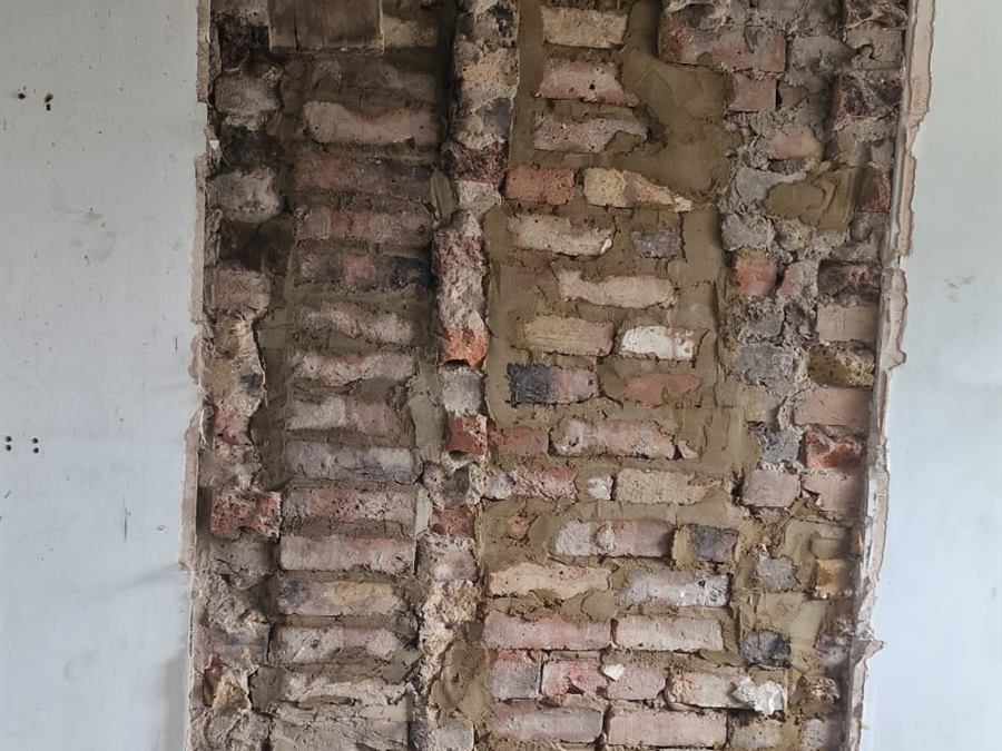 Chimney breast brickwork exposed during removal works