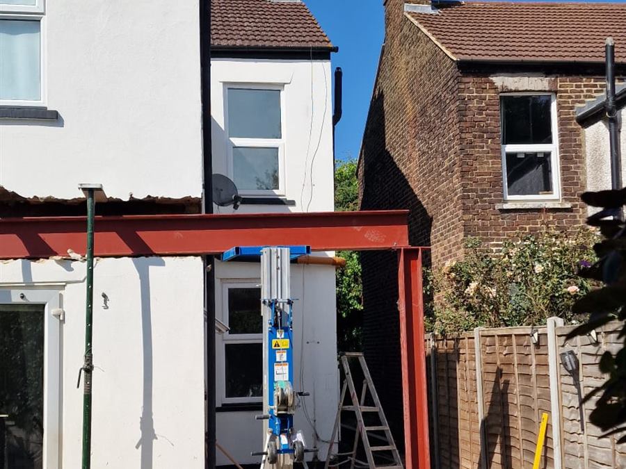 Structural steel portal frame erected for a rear house extension
